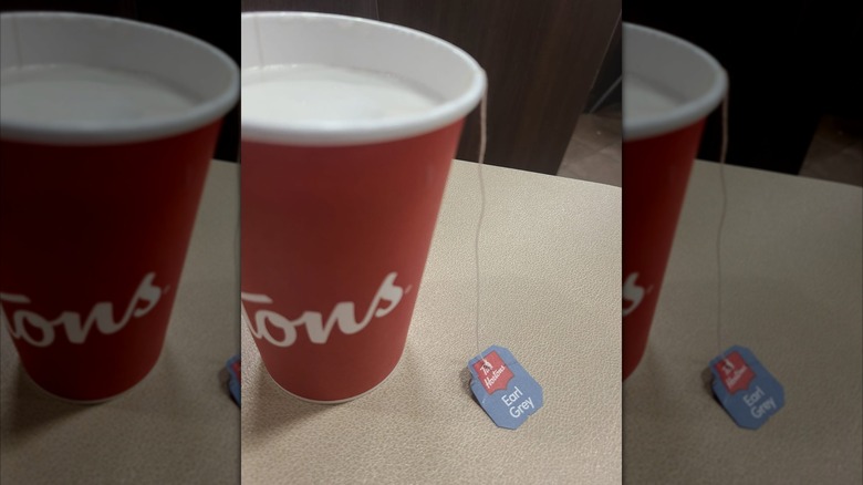 Cup of white hot chocolate with tea