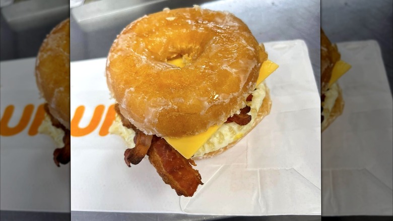 Dunkin' bacon, egg, and cheese sandwich on a donut