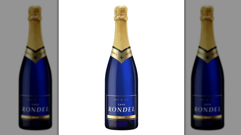 A blue bottle of Rondel Brut Cava with a gold foiled seal