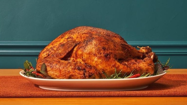 Popeyes Cajun-Style turkey on a platter