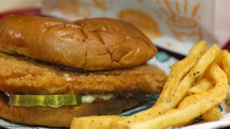 Popeyes spicy flounder sandwich with fries