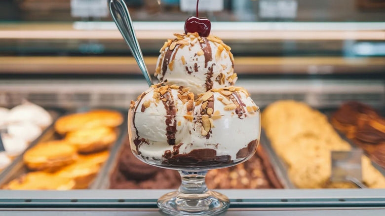 An ice cream sundae on a counter at an ice cream parlor