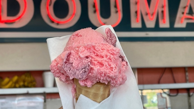 A strawberry ice cream cone from Doumar's Cones & Barbecue