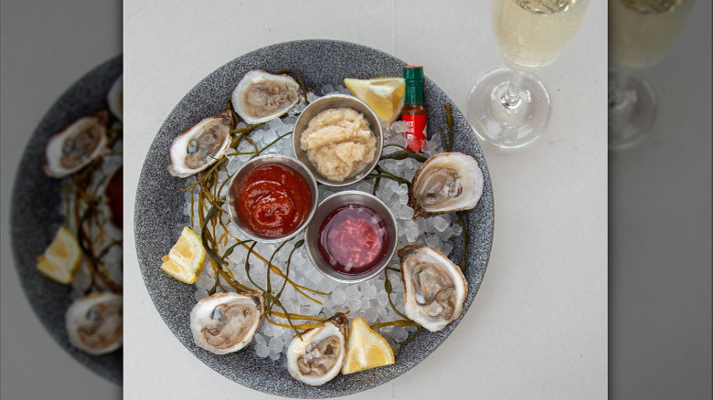 Oyster platter with glass of wine