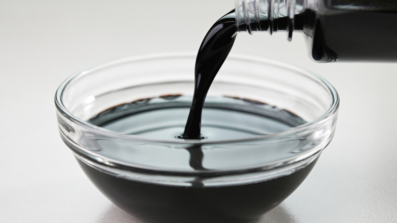 Soy sauce poured into a glass bowl