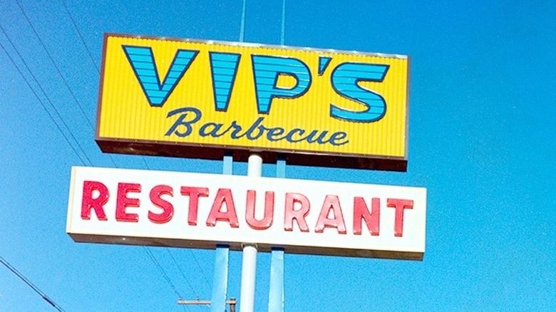 blue and yellow Vip's sign