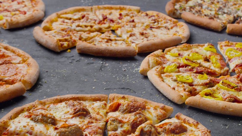 Variety of takeout pizzas on counter