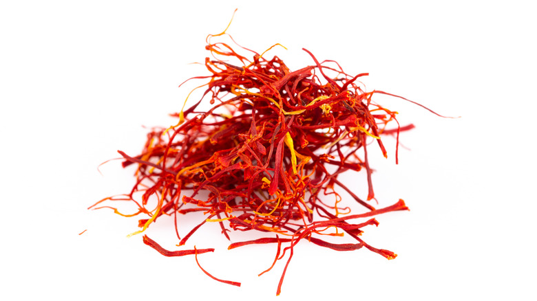 A close-up shot of saffron on a white background