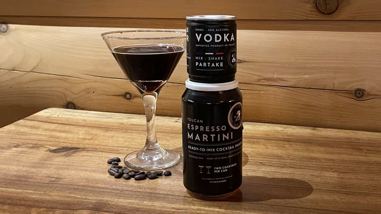 A Toucan espresso martini and its content poured into a martini glass