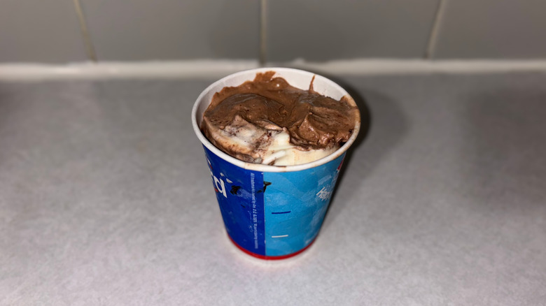 A Blizzard that is three-quarters a rich chocolate color and one quarter vanilla