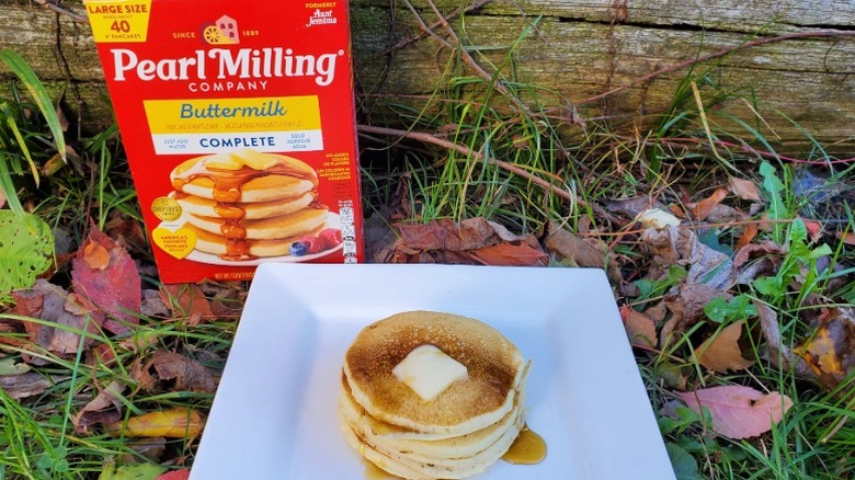 A stack of Pearl Milling pancakes with butter and syrup