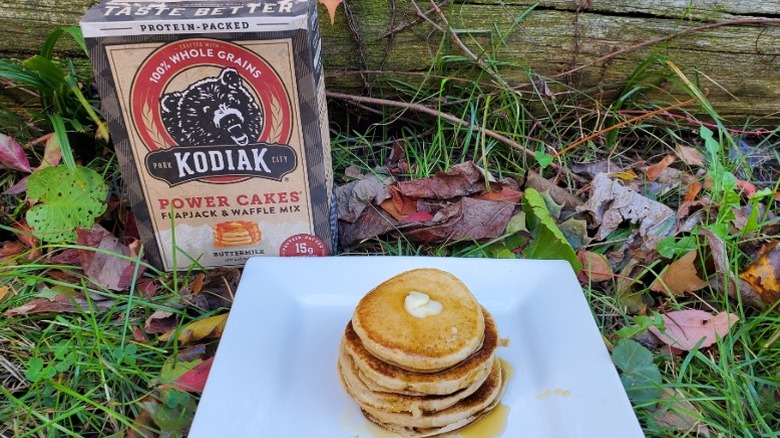 A stack of Kodiak buttermilk pancakes with butter and syrup
