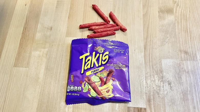 Bag of Takis Fuego with chips above it
