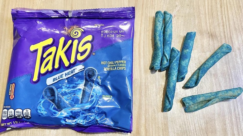 Bag of Takis Blue Heat with chips alongside