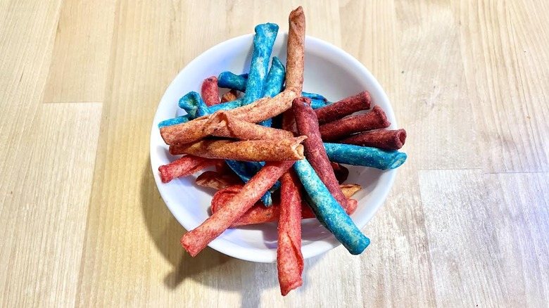 White bowl full of assorted Takis flavors