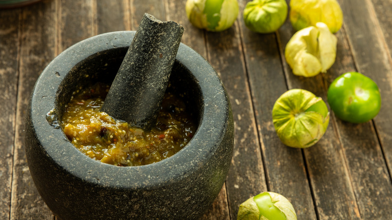 Tomatillo salsa in a molcajete