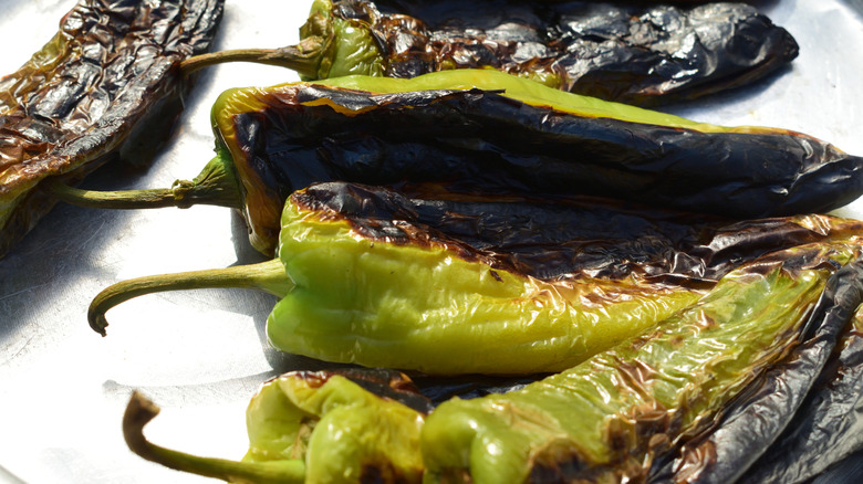 Roasted green chiles with blistered skin