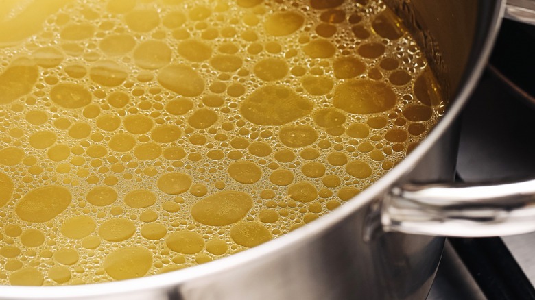 A pot of simmering chicken broth