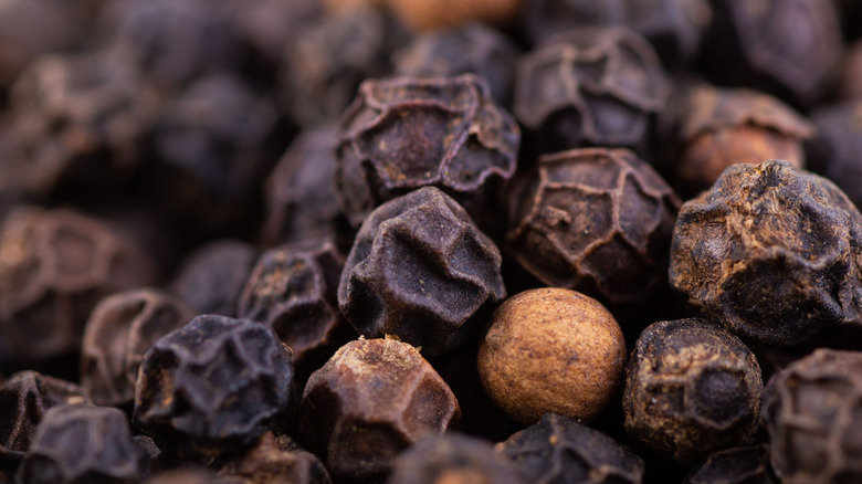 Macro shot of black peppercorns
