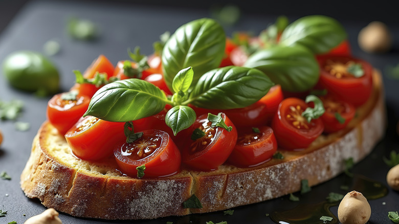 Bruschetta with fresh tomatoes and basil leaves