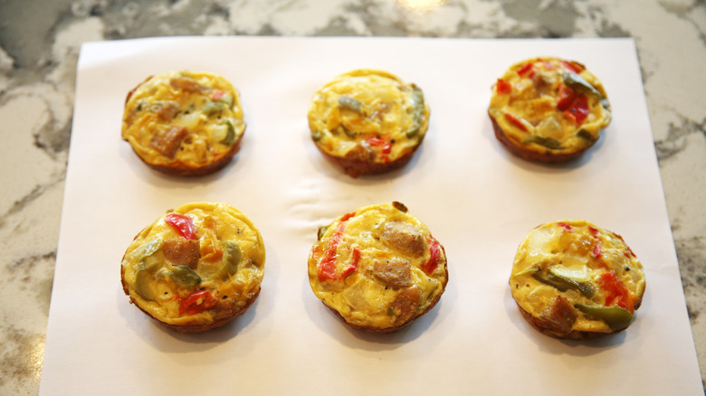 Individual egg muffins on a baking sheet