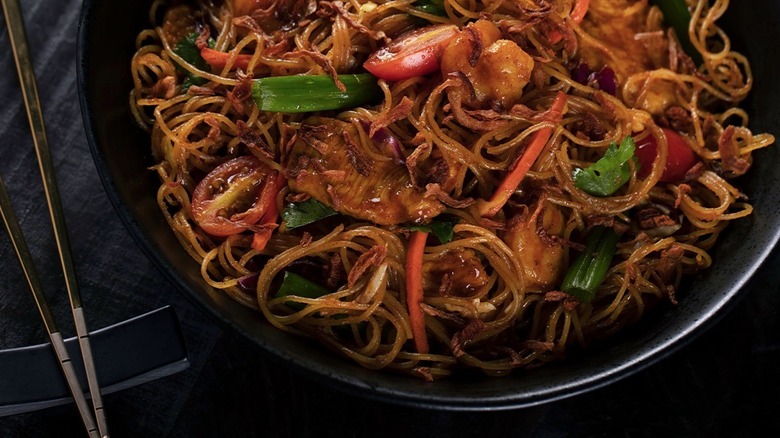 Close-up of black bowl filled with P.F. Chang's Singapore Street Noodles