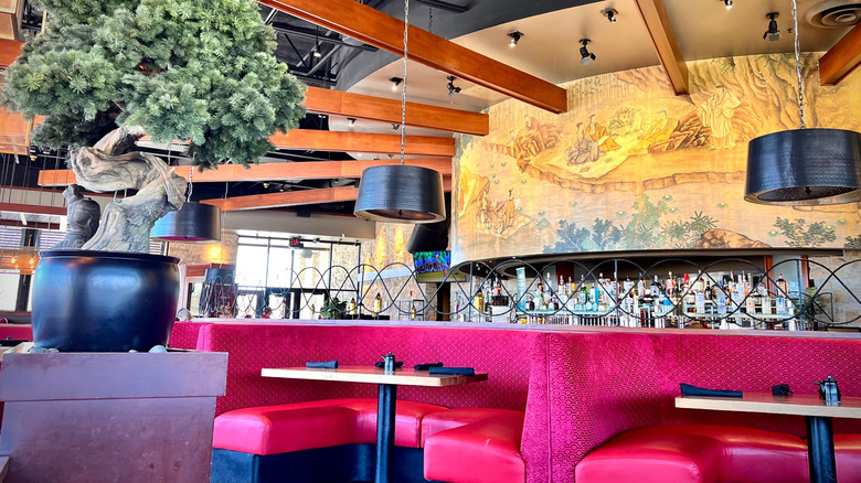 Interior of P.F. Chang's restaurant with large mural in background