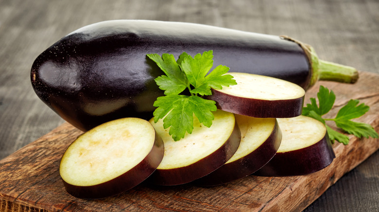 slice eggplant on cutting board
