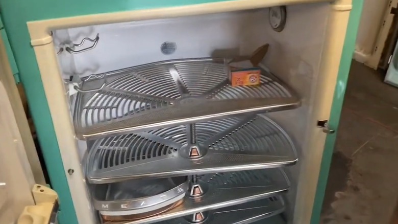 Interior of a GE combination refrigerator with rotating shelves