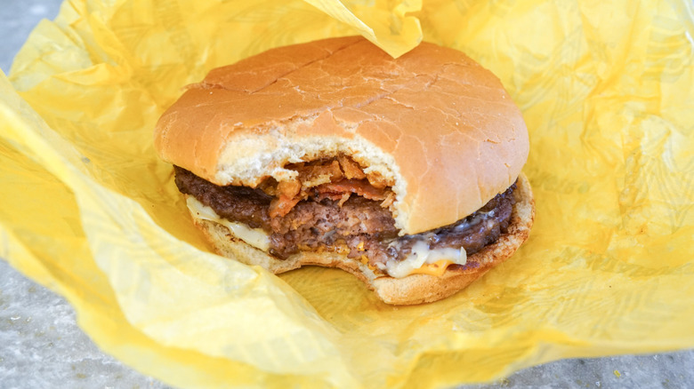 Close-up of Bacon Wrangler Double on yellow wrapper