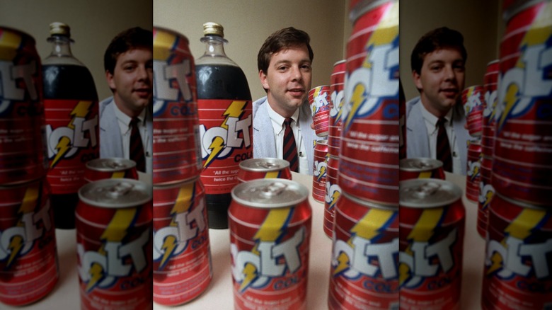C.J. Rapp with a bottle and cans of Jolt Cola