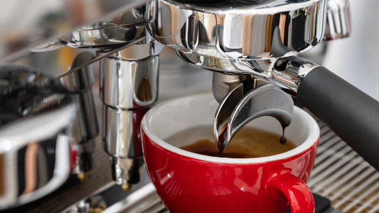Red cup with espresso machine