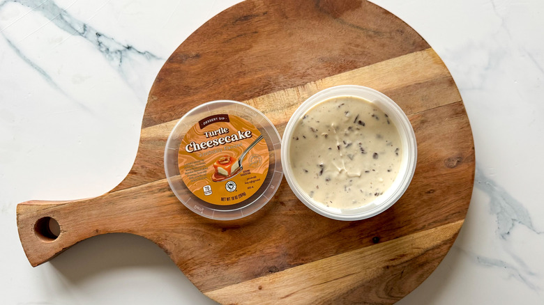 Turtle Cheesecake Dessert Dip on round, wooden cutting board