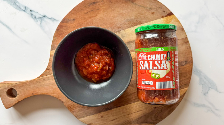 Mild Chuky Salsa on round, wooden cutting board
