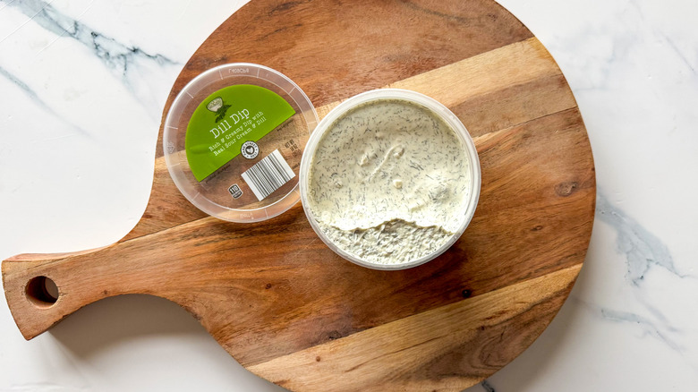 Dill Dip on round, wooden cutting board