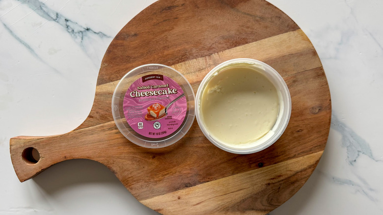 Salted Caramel Cheesecake Dessert Dip on round, wooden cutting board