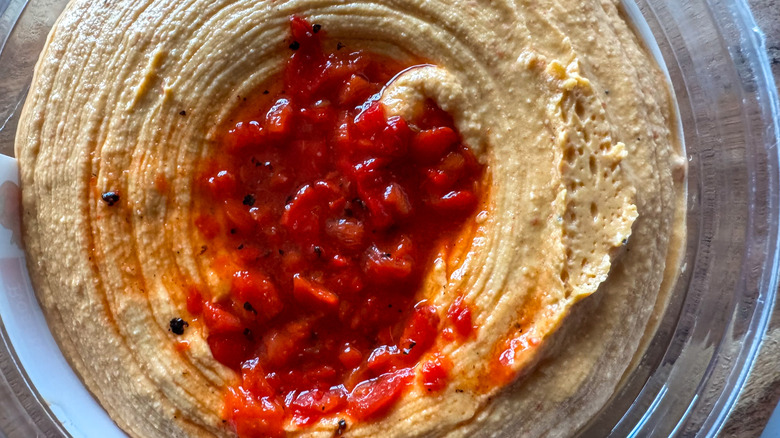 Up-close shot of red pepper hummus