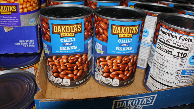 Canned beans on grocery store shelf