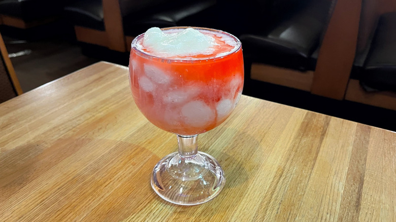The frozen Piña Colada with a strawberry swirl from Applebee's in a mucho goblet