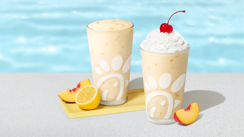 Two Chick-fil-A Frosted Peach Lemonades in pint glasses