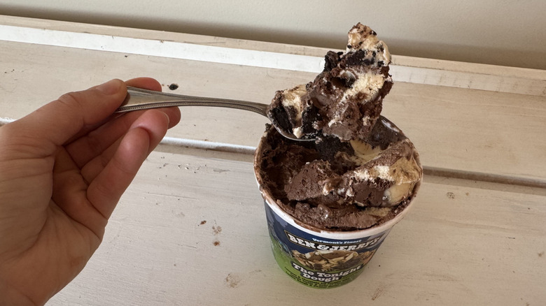 Person holding a spoonful of ice crean