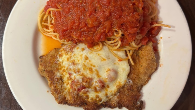 A plate of chicken Parmesan with spaghetti at Buca di Beppo