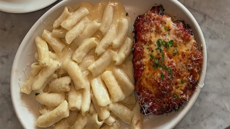 A plate of chicken Parmesan with pasta at North Italia