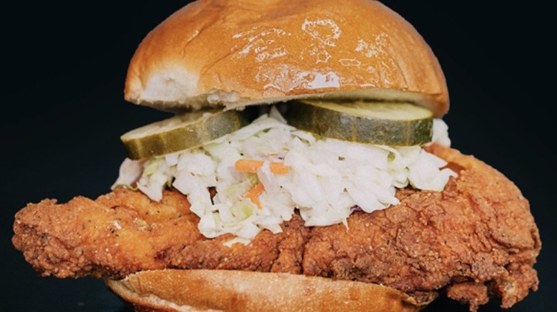 The Clutch It Like It's Hot sandwich on a black background.