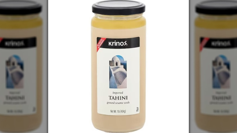Jar of Krinos tahini, a beige colored paste in a tall jar.