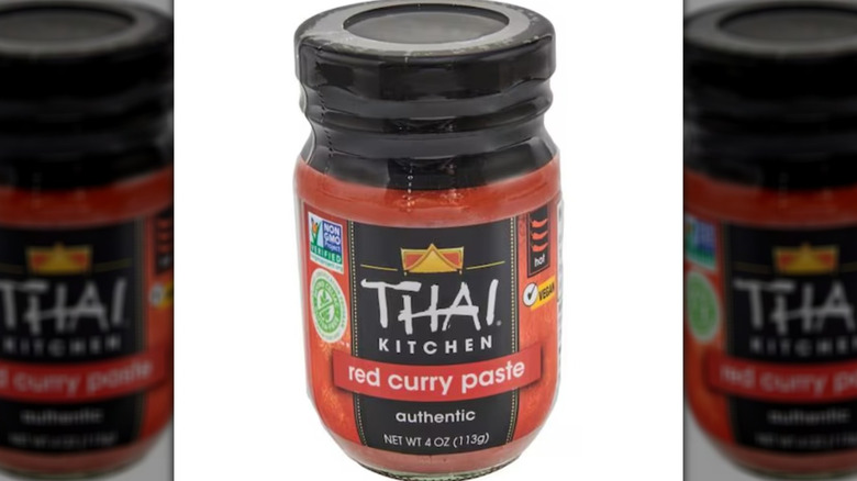 Thai Curry Paste in a small glass jar with a black lid.
