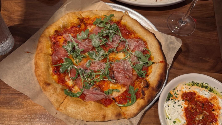 A pizza on a table at North Italia