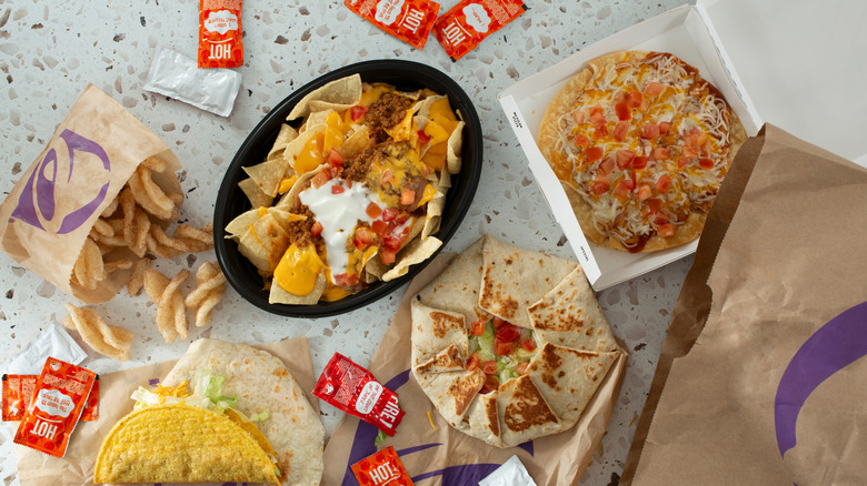 A variety of Taco Bell dishes including nachos, tostadas, and cinnamon twists