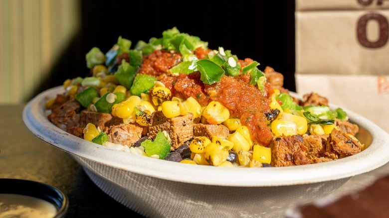A burrito bowl from Panchero's Mexican Grill loaded with green chiles and corn