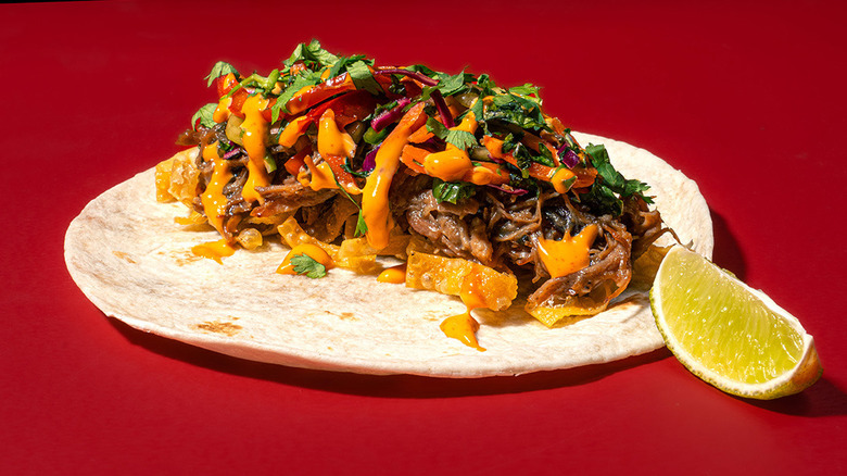 A green chili pork taco from Torchy's Tacos